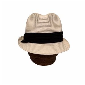 White hat with black ribbon
